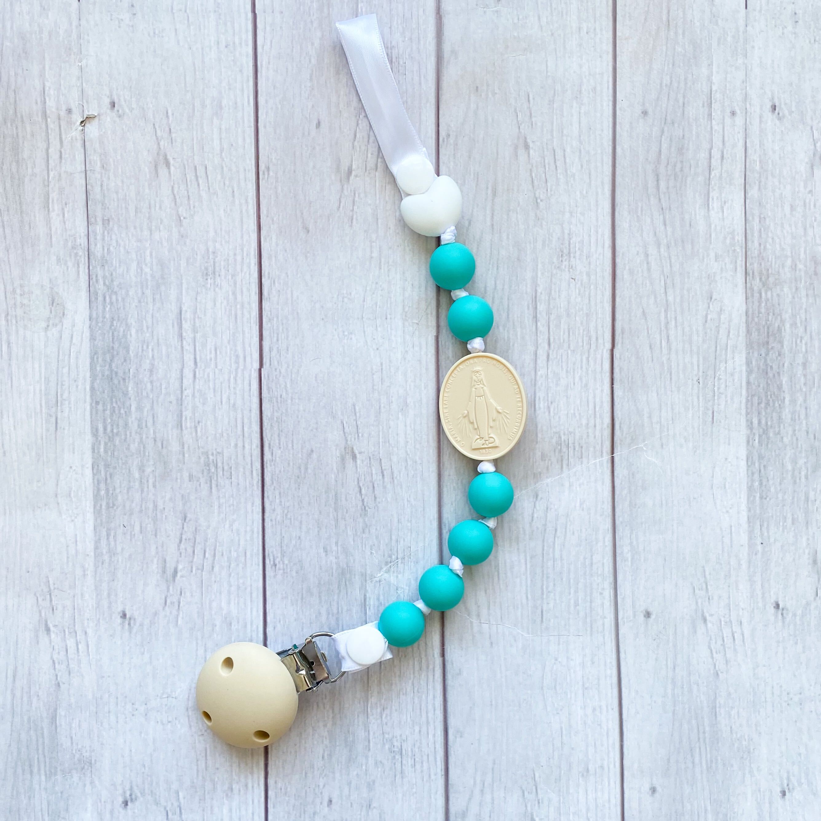 chews-life-silicone-pacifier-clip-turquoise-cream-miraculous-medal-31349541994672.jpg